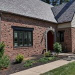 After photo of new black windows and new Everlast siding.