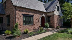 After photo of new black windows and new Everlast siding.