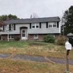 before photo of split level home that is getting new vinyl siding