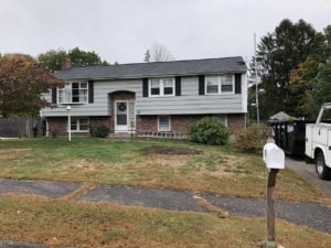 before photo of split level home that is getting new vinyl siding