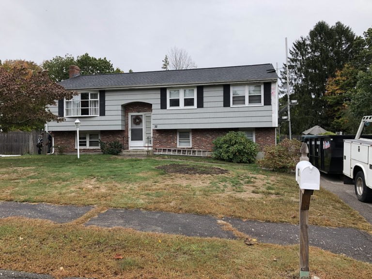 before photo of split level home that is getting new vinyl siding