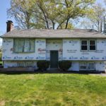 Inprogress photo showing right before the vinyl siding and andersen storm door installation.