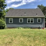 Back elevation of new vinyl siding installation