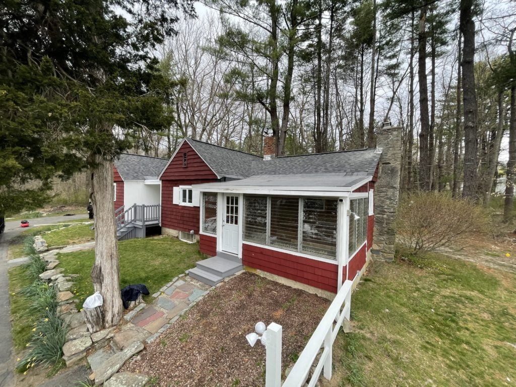 flat roofing contractor working on a home in west Bridgewater, Massachusetts