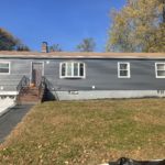 front elevation after photo of composite siding installation