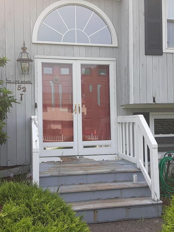before photo showing old entry doors in Randolph, Massachusetts