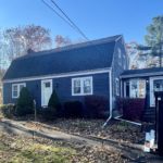 Before photo showing old roofing that was improperly flashed.