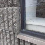 before photo of old aluminum window caulking