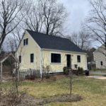 After photo of new roofing, siding, windows, and doors installed