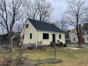 After photo of new roofing, siding, windows, and doors installed