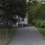 before the installation of new porch, roofing, siding, windows, and doors