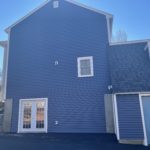 right elevation of home with new certainteed d4 midnight blue siding