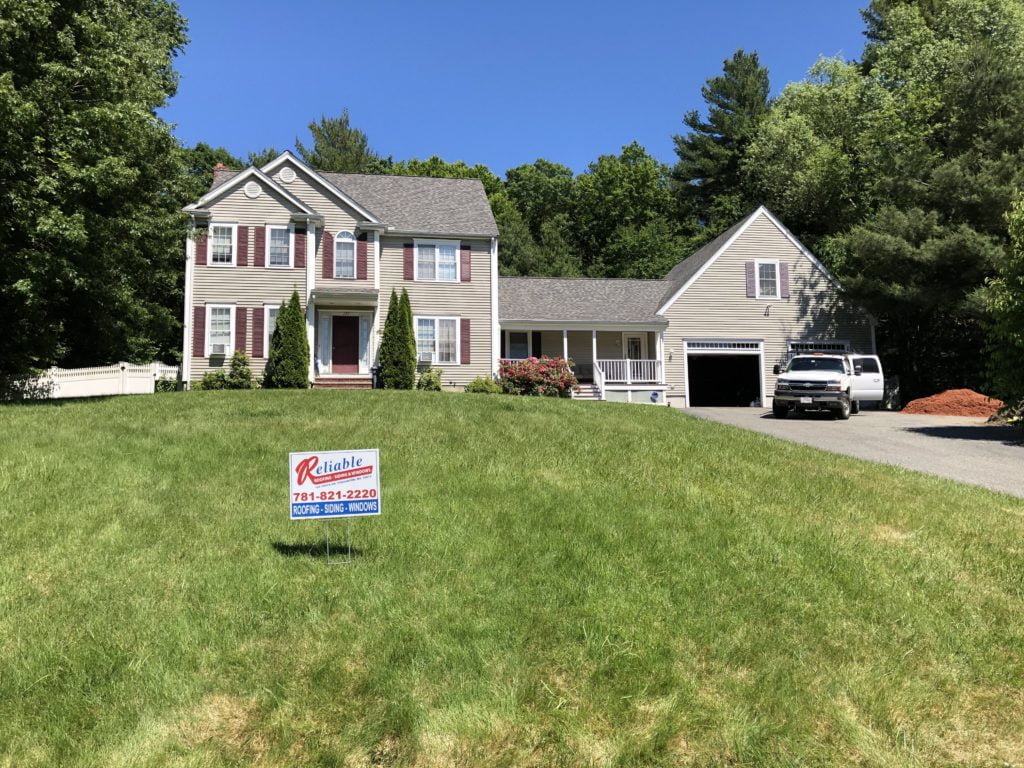 after photo showing new roof replacement on this home in Raynham, Massachusetts