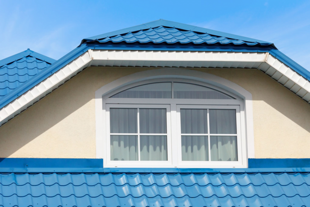 The stylish look of blue metal roofing provides an elegant finish to this home.
