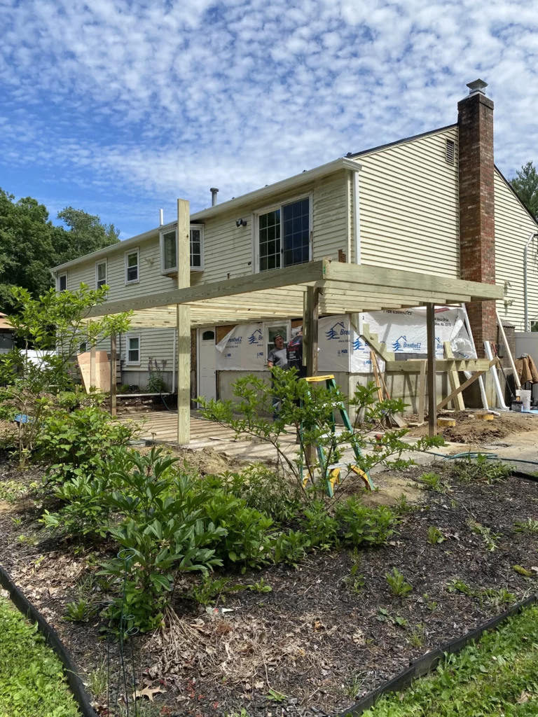 in progress photo of the new roof deck and 4 season room under the deck.