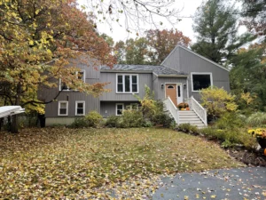 After Photo of Reliable replacing an old roof, installing new home siding, and replacement of new windows.