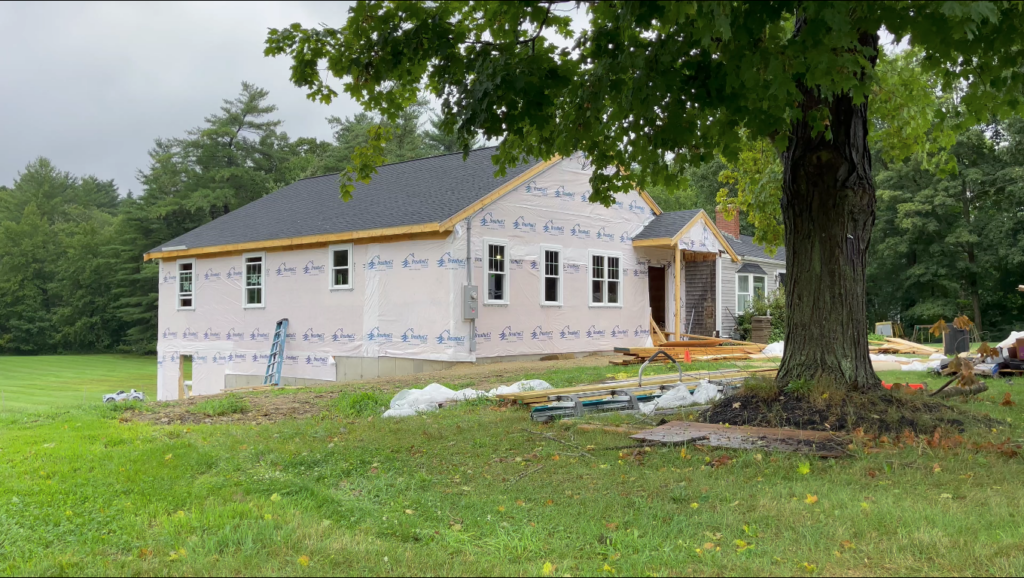 exterior before siding installation of residential home addition completed and weather tight.