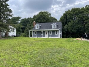 after photo of new roofing, siding, and farmers porch