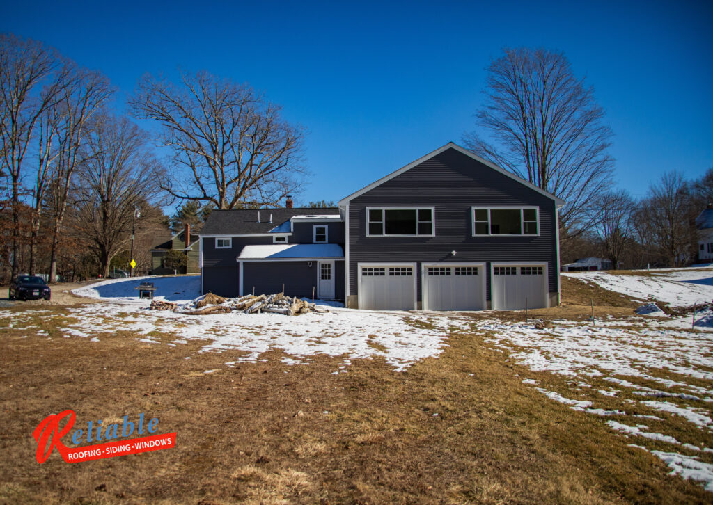 conventional house addition with 3 car garage