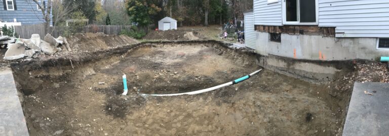 sewer line being re-routed to the street from the old sewer basin in Stoughton, Massachusetts.