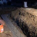 foundation footings poured and waiting to dry in stoughton, ma at our conventional house addition.