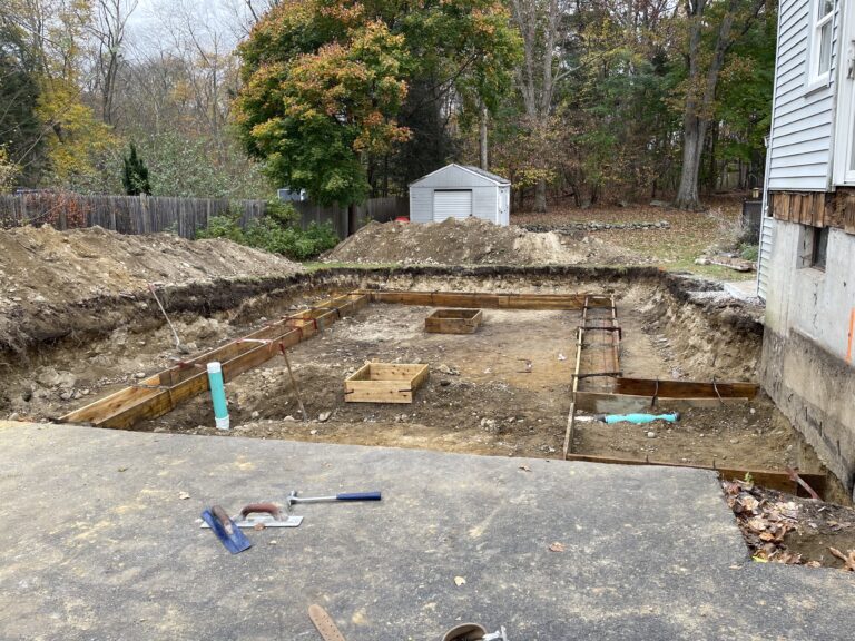 concrete footings forms set up and ready for concrete in stoughton, massachusetts.
