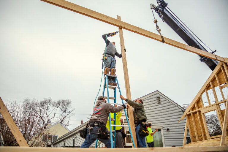 Roof peak being installed securing the two end walls at our in-law addition in stoughton, ma.