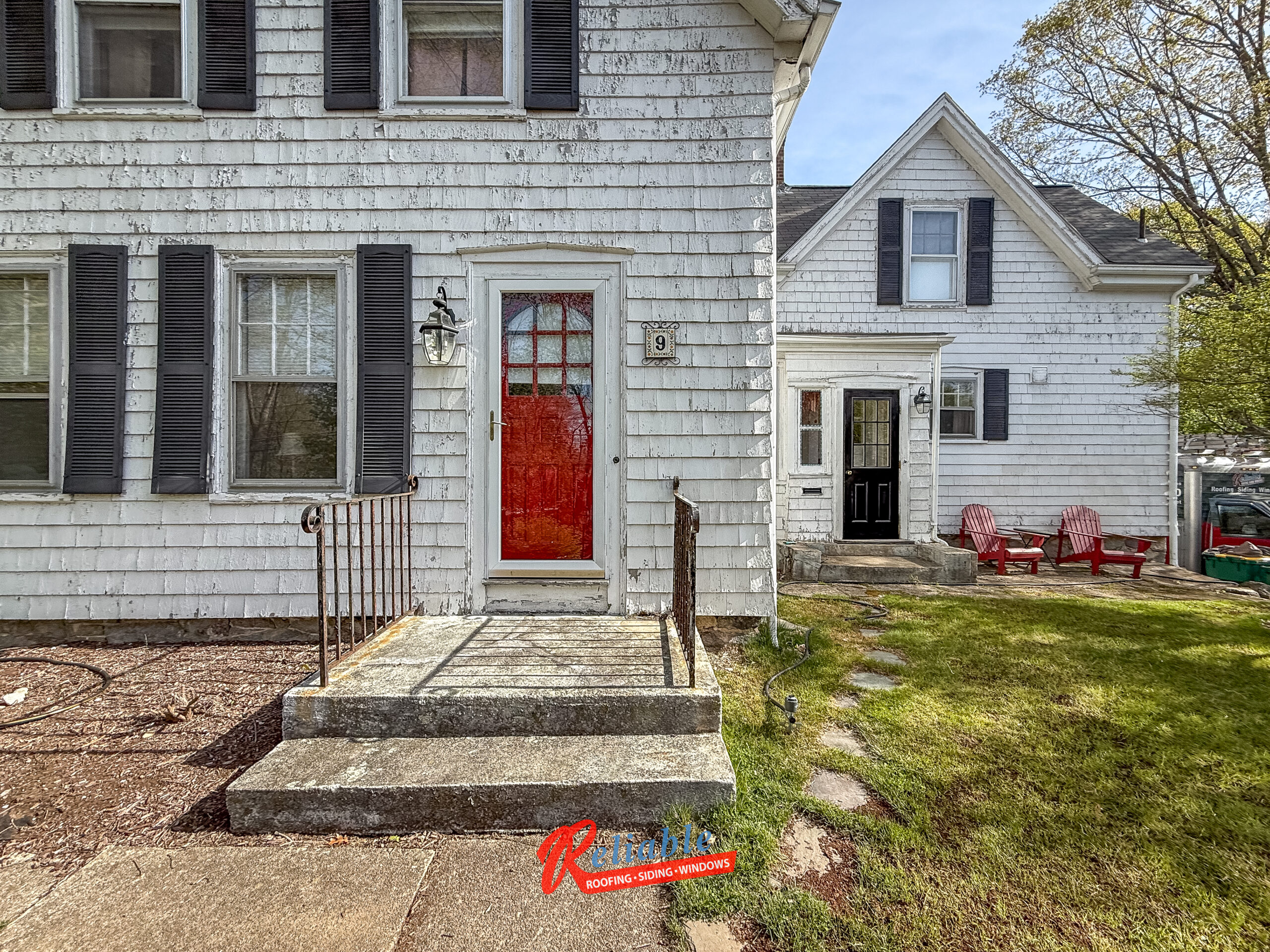 Before exterior renovation in Easton MA with outdated siding and windows