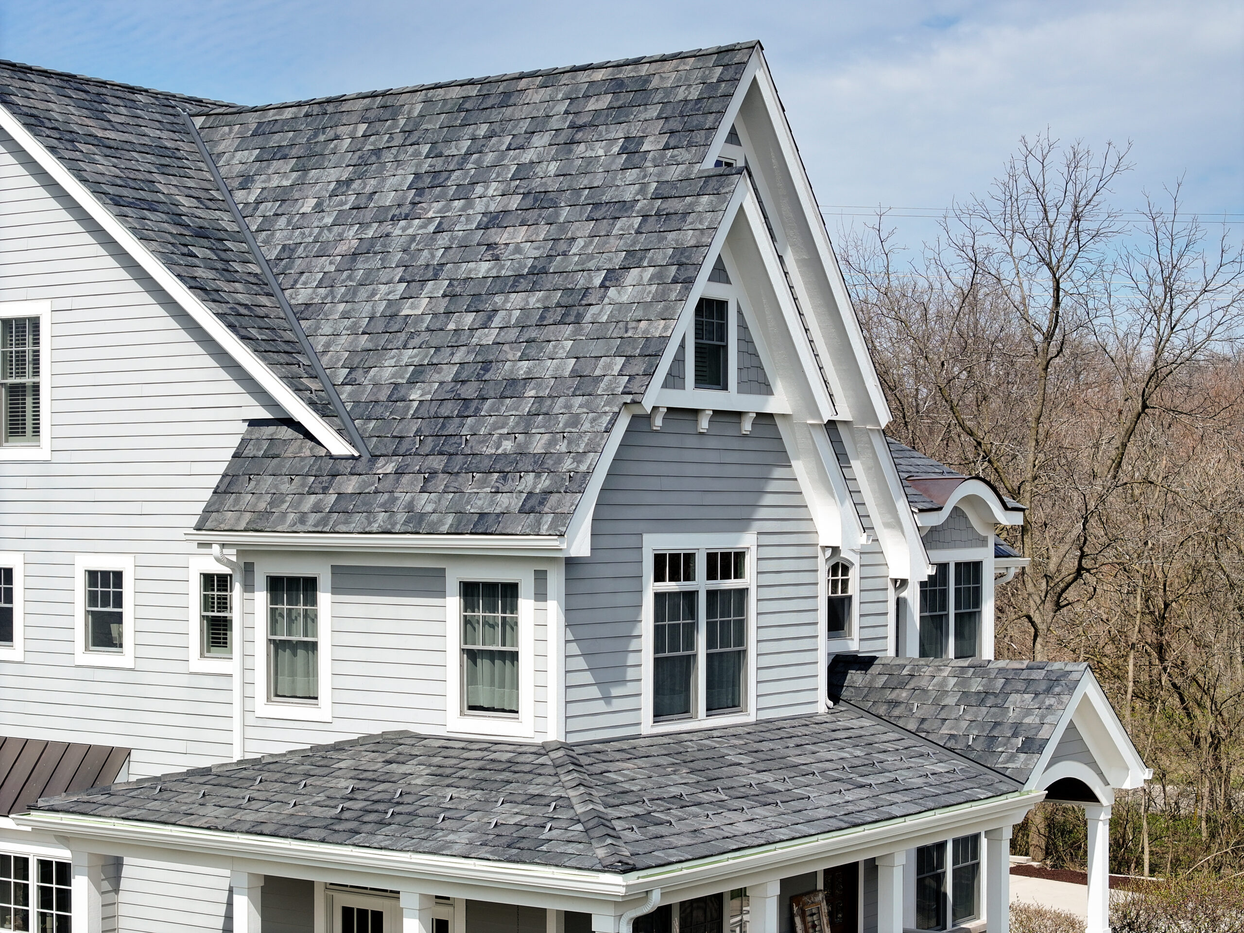 brava synthetic roof tile installation using slate roof tiles. Massachusetts contractor specializing in the installation of synthetic composite roofing productions by Brava on historic and coastal homes, and homeowner associations.