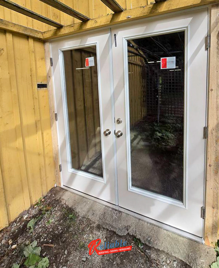 Therma-Tru fiberglass double entry doors installed at Mass Audubon Drumlin Farm Poultry House in Lincoln, MA for energy-efficient renovation upgrades