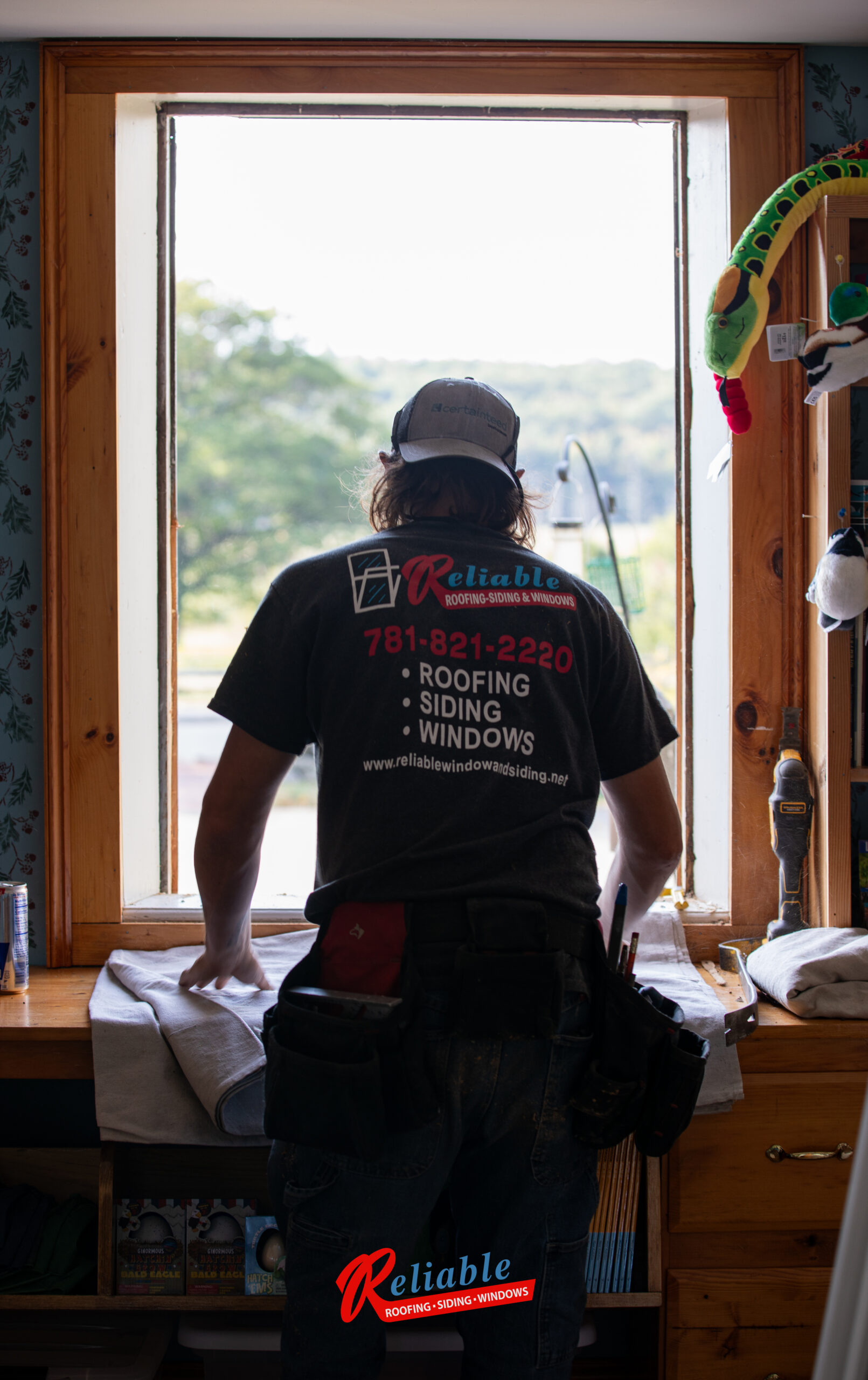 Professional installation of Harvey Majesty energy-efficient wood windows at the Goodnow House in Princeton, Massachusetts, carefully preserving historic features.
