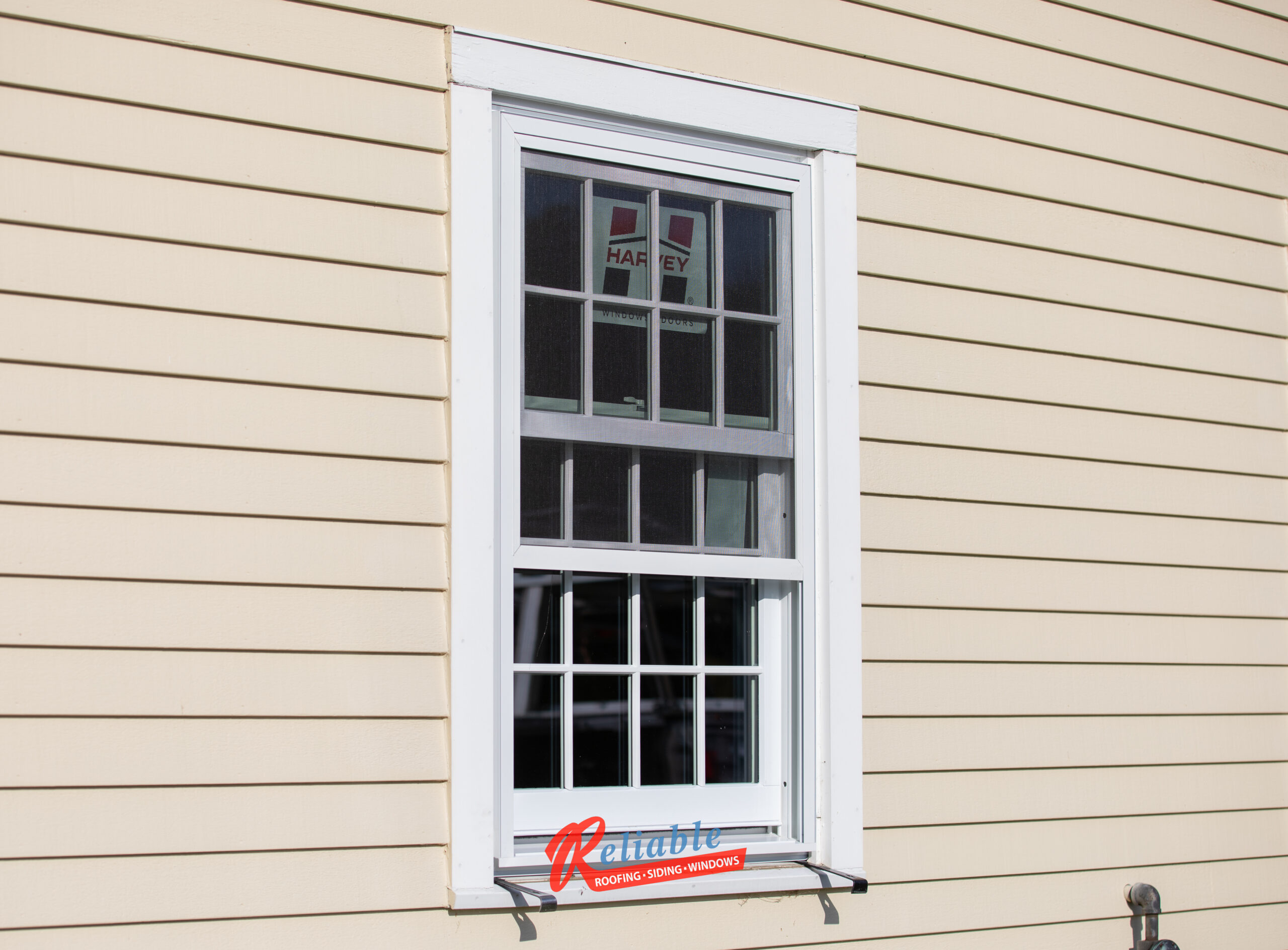 Professional installation of Harvey Majesty energy-efficient wood windows at the Goodnow House in Princeton, Massachusetts, carefully preserving historic features.