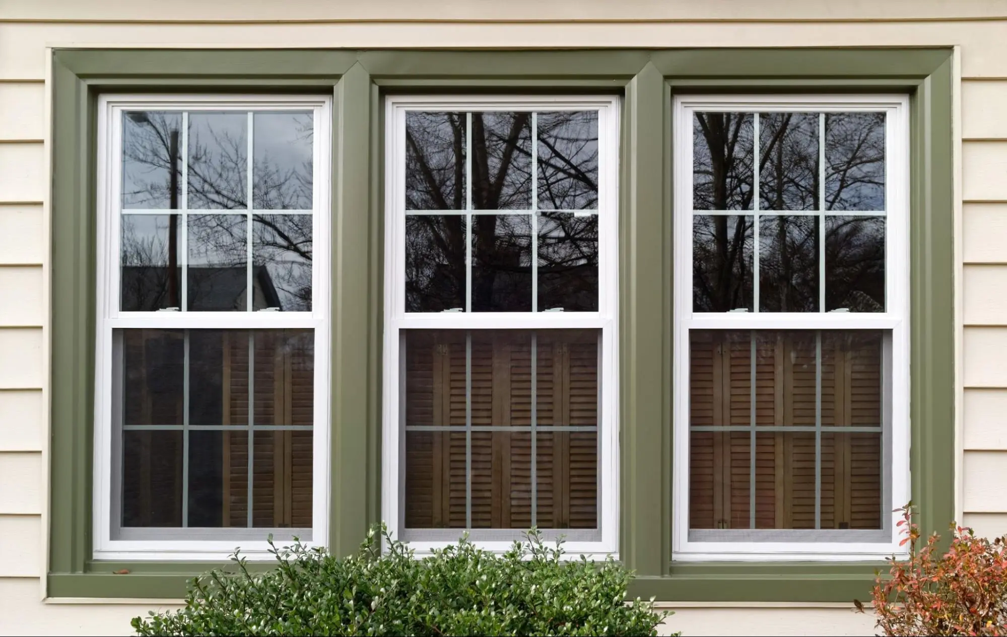 Vinyl window replacement in a Walpole, MA home with custom trim detail.