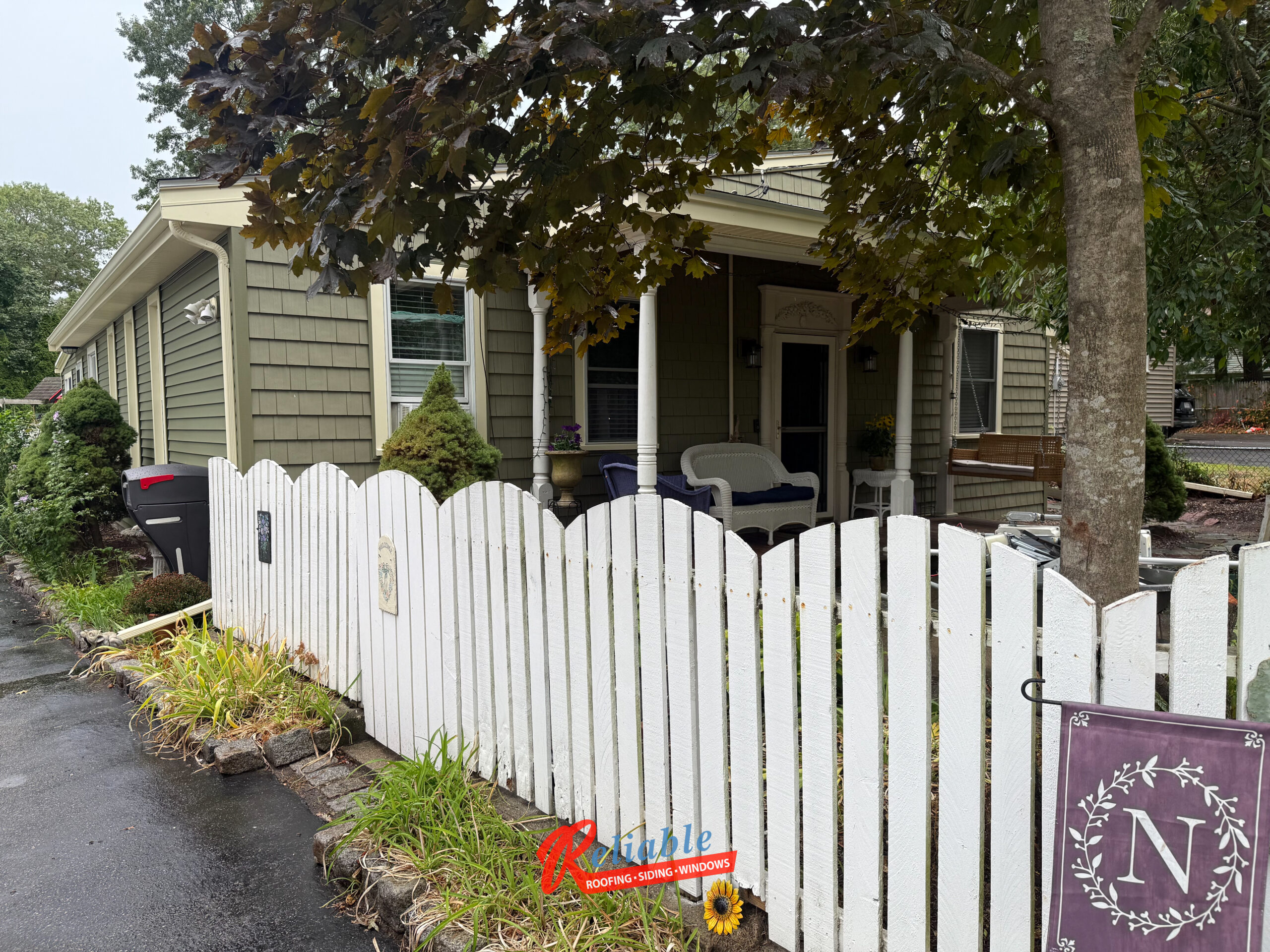 CertainTeed Cedar Impressions siding accent in Spruce color adding texture and depth to Randolph MA home exterior.