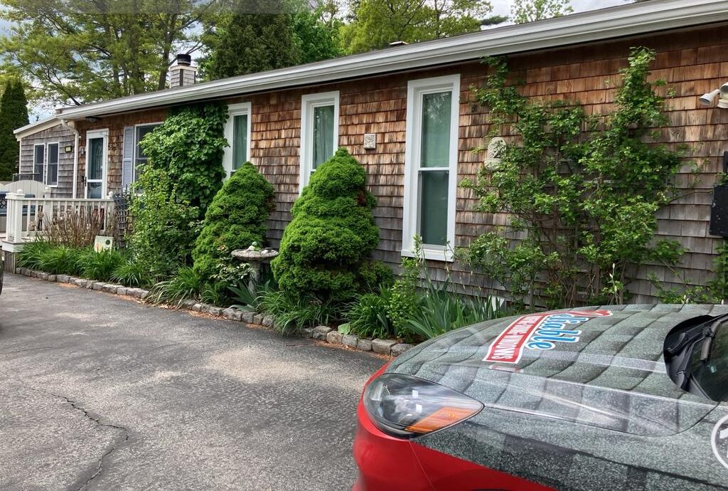 Randolph MA home exterior before renovation showing old wood shingles and outdated siding